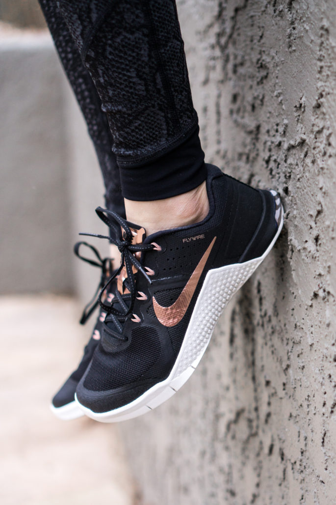nike rose gold and black shoes